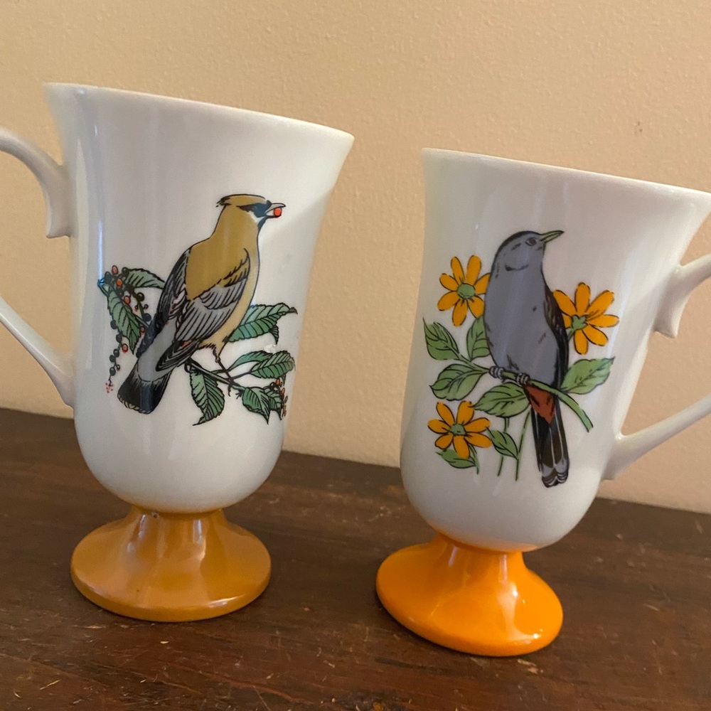 Pair of vintage pedestal mugs with bird motif